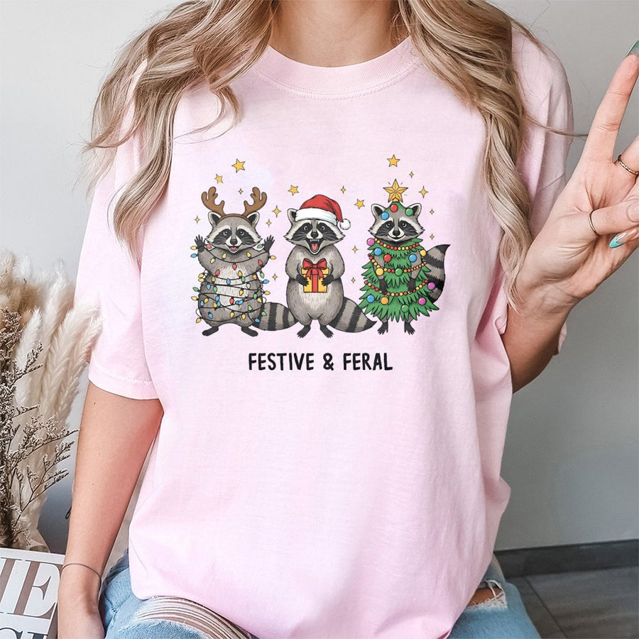 Festive and Feral Raccoon T-Shirt | Funny Christmas Animal Graphic | Soft 100% Cotton Premium Tee | Unique Holiday Gift for Men and Women