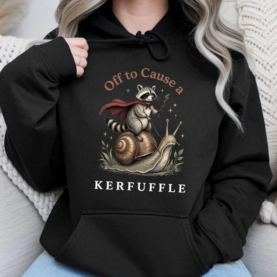 Raccoon Riding Snail Hoodie | Off To Cause A Kerfuffle Funny Graphic | Premium Cotton Blend | Whimsical Gift For Nature And Animal Lovers