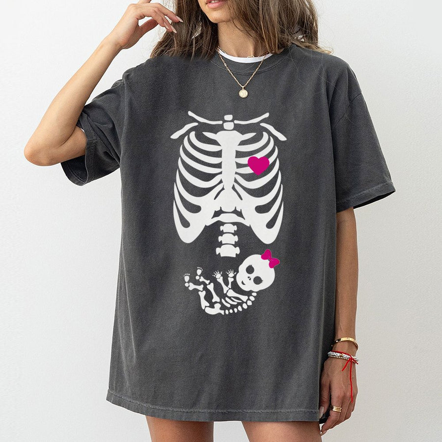 Funny Pregnant Skeleton T-Shirt | Cute Baby Girl Skeleton Reveal Graphic | Premium Soft Cotton Tee | Maternity Halloween Gift For Expecting Mom