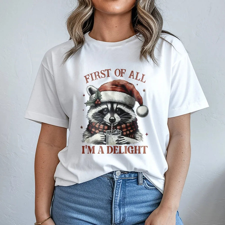 Funny Raccoon Christmas T-Shirt | First Of All I'm A Delight Quote | Premium Cotton Graphic Tee | Cute Animal Holiday Gift For Raccoon Lovers