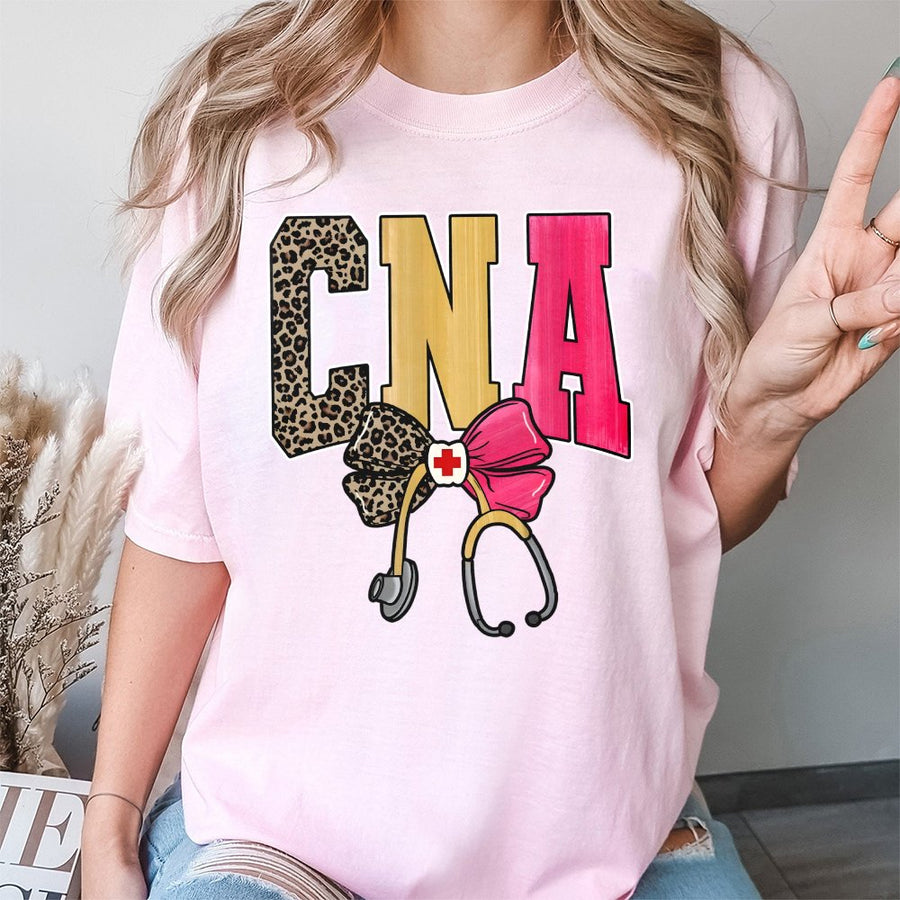 CNA T-Shirt | Leopard Print Nursing Assistant Graphic with Bow and Stethoscope | 100% Cotton Premium Tee | Unique Gift for Certified Nursing Assistants
