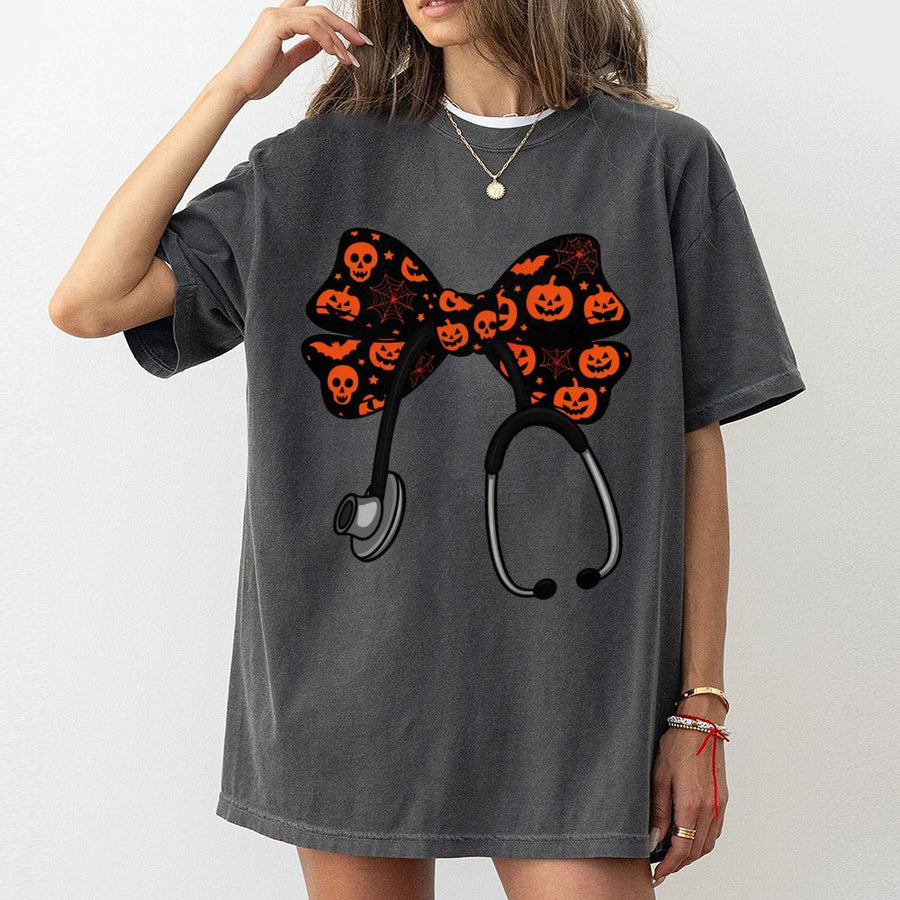 Nurse Halloween T-Shirt | Coquette Bow Stethoscope Design | Premium 100% Cotton Tee | Spooky Season Gift for Nurses, RNs, and Nursing Students