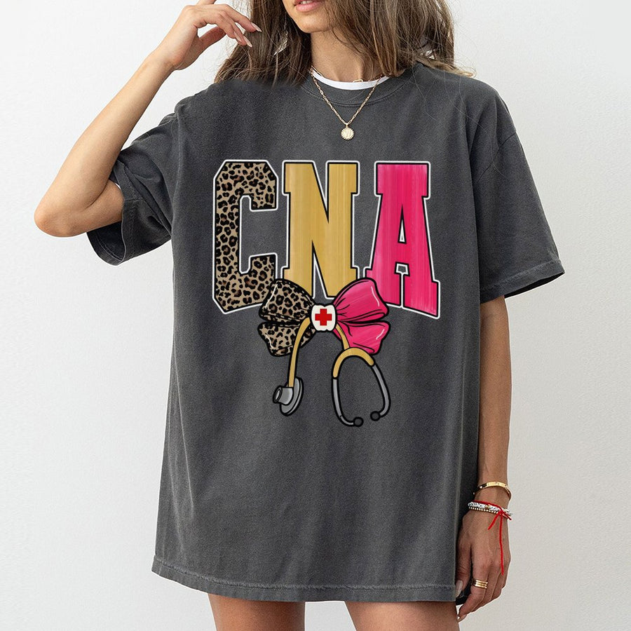CNA T-Shirt | Leopard Print Nursing Assistant Graphic with Bow and Stethoscope | 100% Cotton Premium Tee | Unique Gift for Certified Nursing Assistants