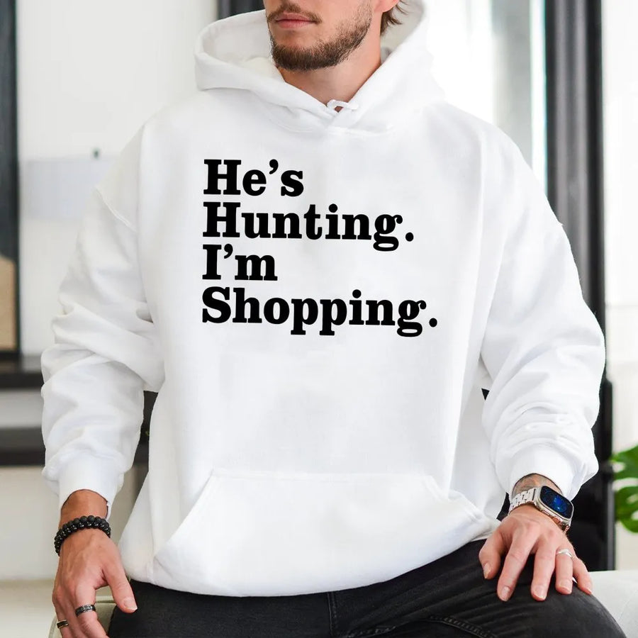 He's Hunting I'm Shopping Hoodie | Funny Country Life Graphic Sweatshirt | Premium Cotton Blend Apparel | Gift for Hunter Wife Girlfriend