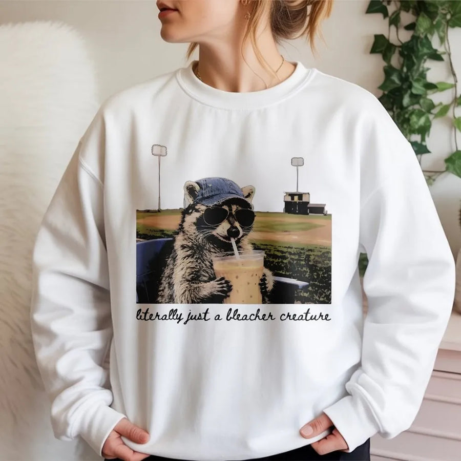 Raccoon Baseball Sweatshirt | Funny Bleacher Creature Graphic | Cotton Blend Apparel | Gift for Baseball Mom and Softball Fan