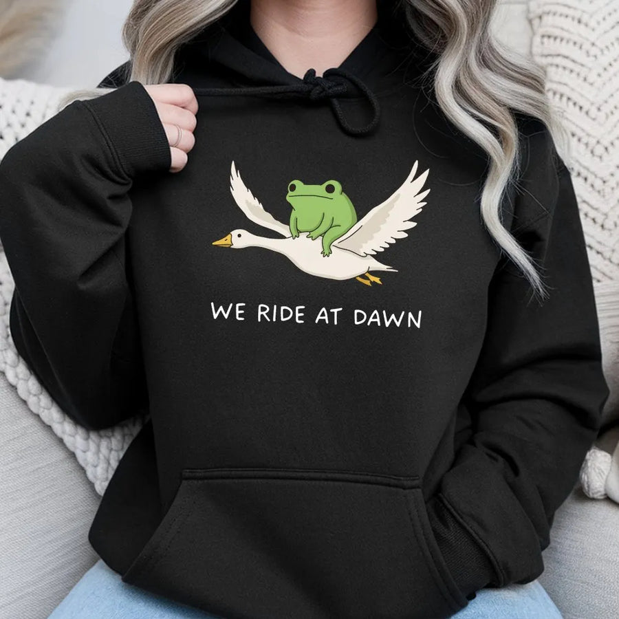 We Ride at Dawn Hoodie | Funny Frog Riding Goose Graphic | Premium Cotton Blend | Unisex Gamer & Meme Lover Gift