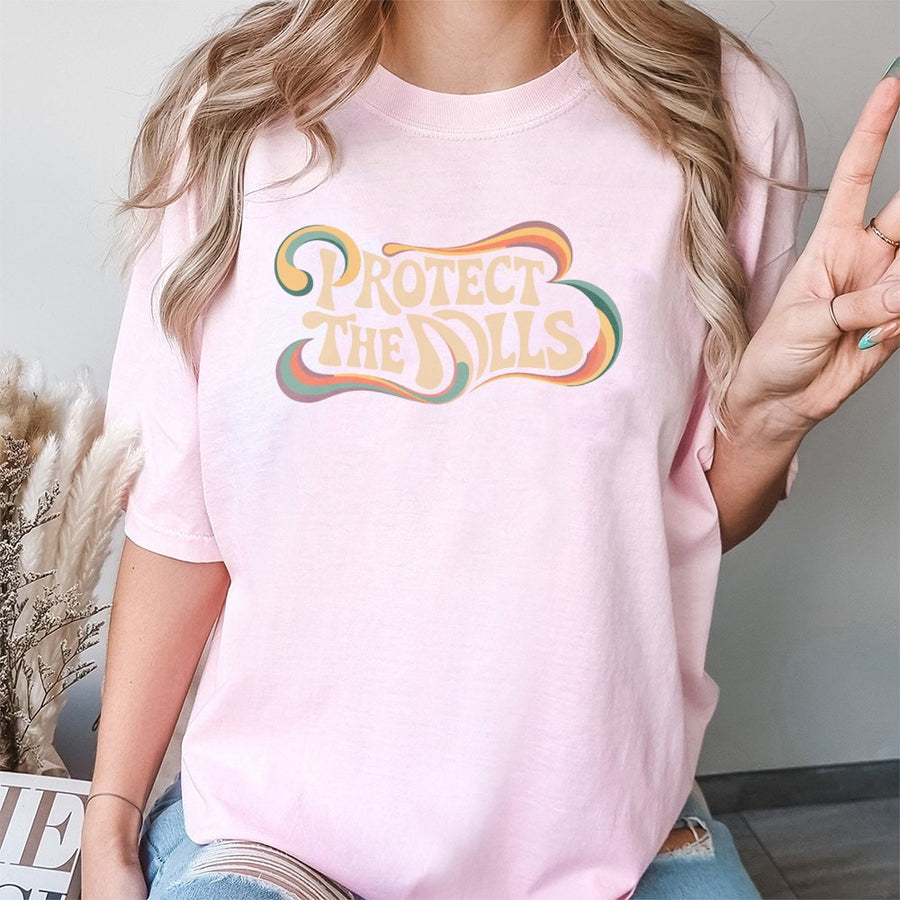 Protect The Dolls T-Shirt | Retro 70s Groovy Graphic Typography | Premium 100% Cotton | Feminist Empowerment Gift For Women