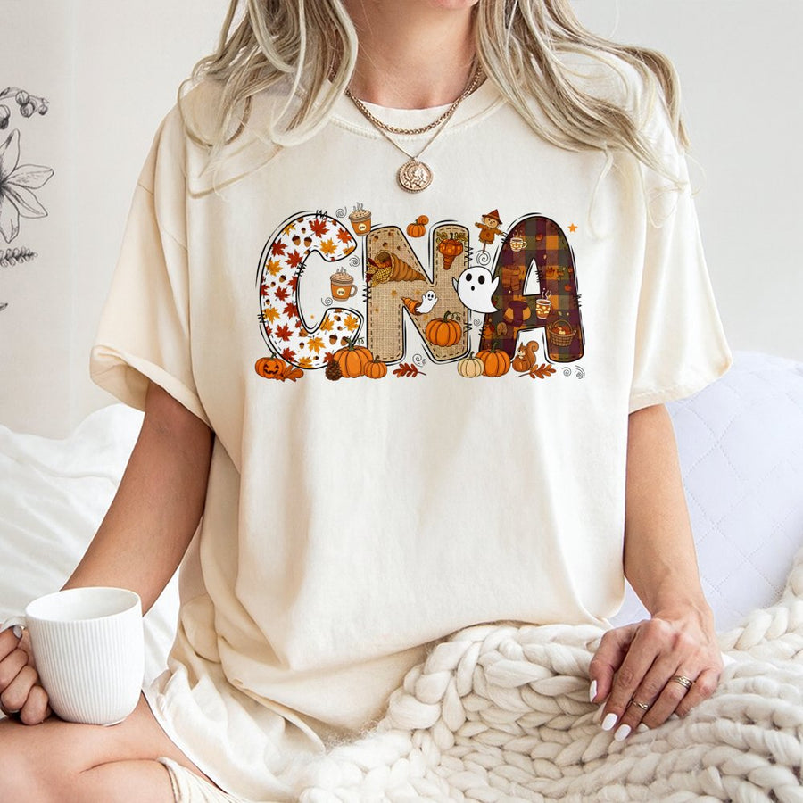 CNA Fall T-Shirt | Pumpkin Halloween Graphic Nursing Assistant Gift | 100% Cotton Premium Tee | Autumn Apparel for Medical Professionals