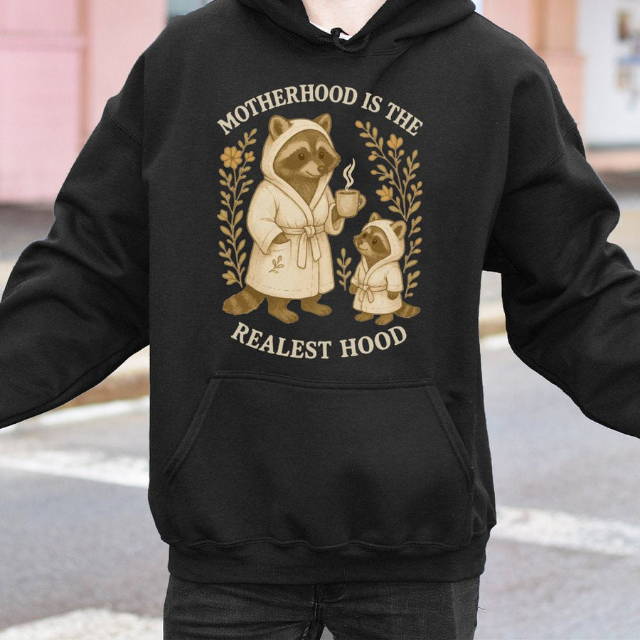 Motherhood Is The Realest Hood Hoodie | Cute Raccoon Mom Design | Premium Cotton Blend | Funny Mother's Day 2026 Gift For New Mom