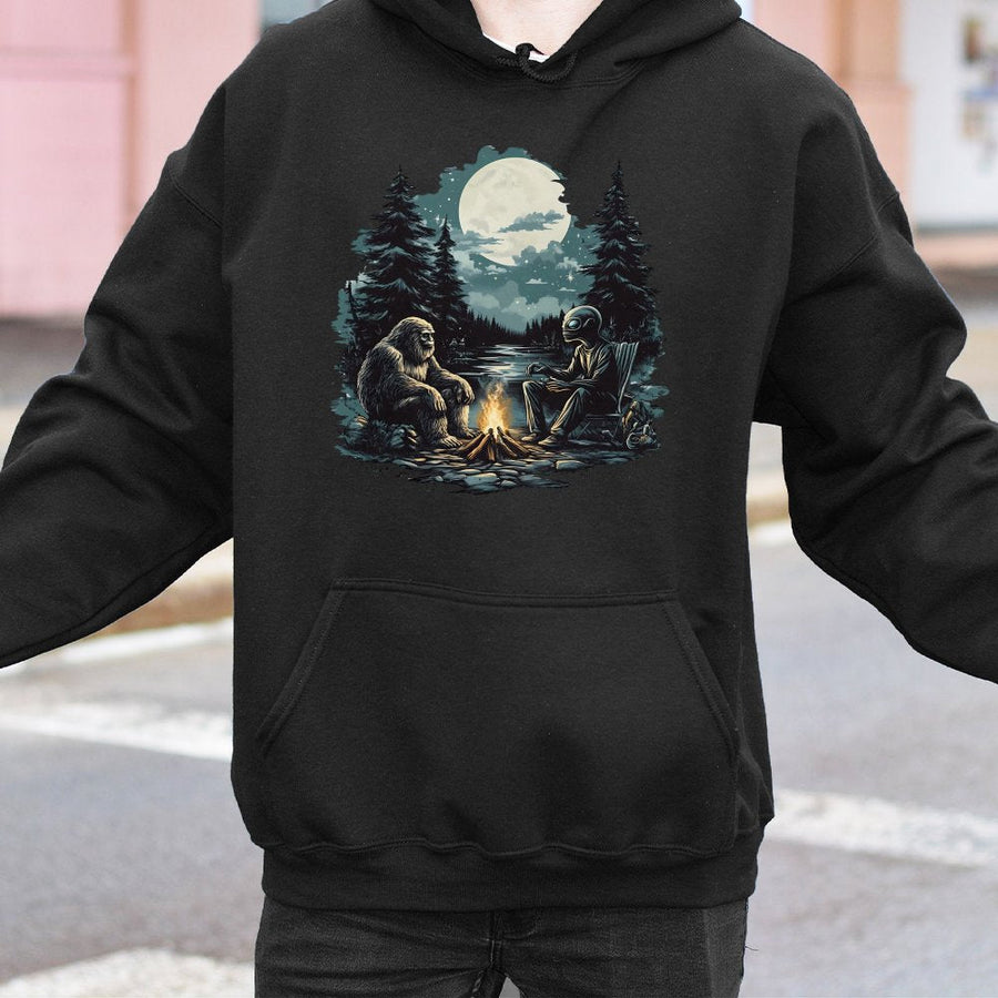 Bigfoot and Alien Hoodie | Campfire Forest Graphic Sweatshirt | Premium Cotton-Blend Pullover | Funny Cryptid Lover Gift for Men and Women