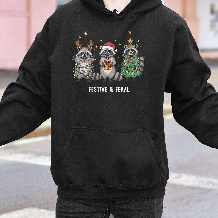Festive and Feral Raccoon Hoodie | Funny Christmas Animal Graphic | Premium Cotton Blend Unisex Sweatshirt | Cute Holiday Gift for Wildlife Lovers