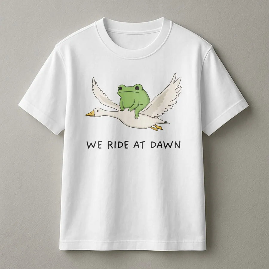 We Ride at Dawn T-Shirt | Funny Frog Riding Goose Graphic | Premium Cotton Blend | Unisex Gamer & Meme Lover Gift