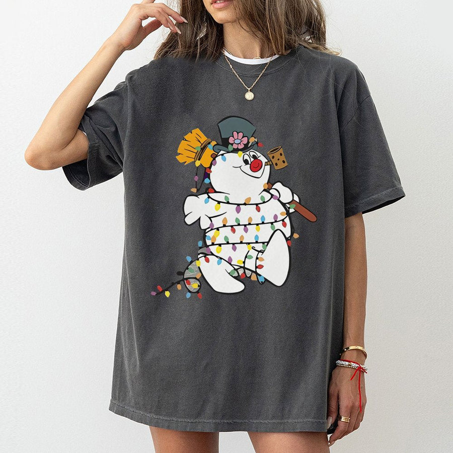 Snowman Christmas Graphic T-Shirt | Festive Holiday Lights Cartoon Design | 100% Cotton Premium Tee | Unisex Gift for Holiday Lovers