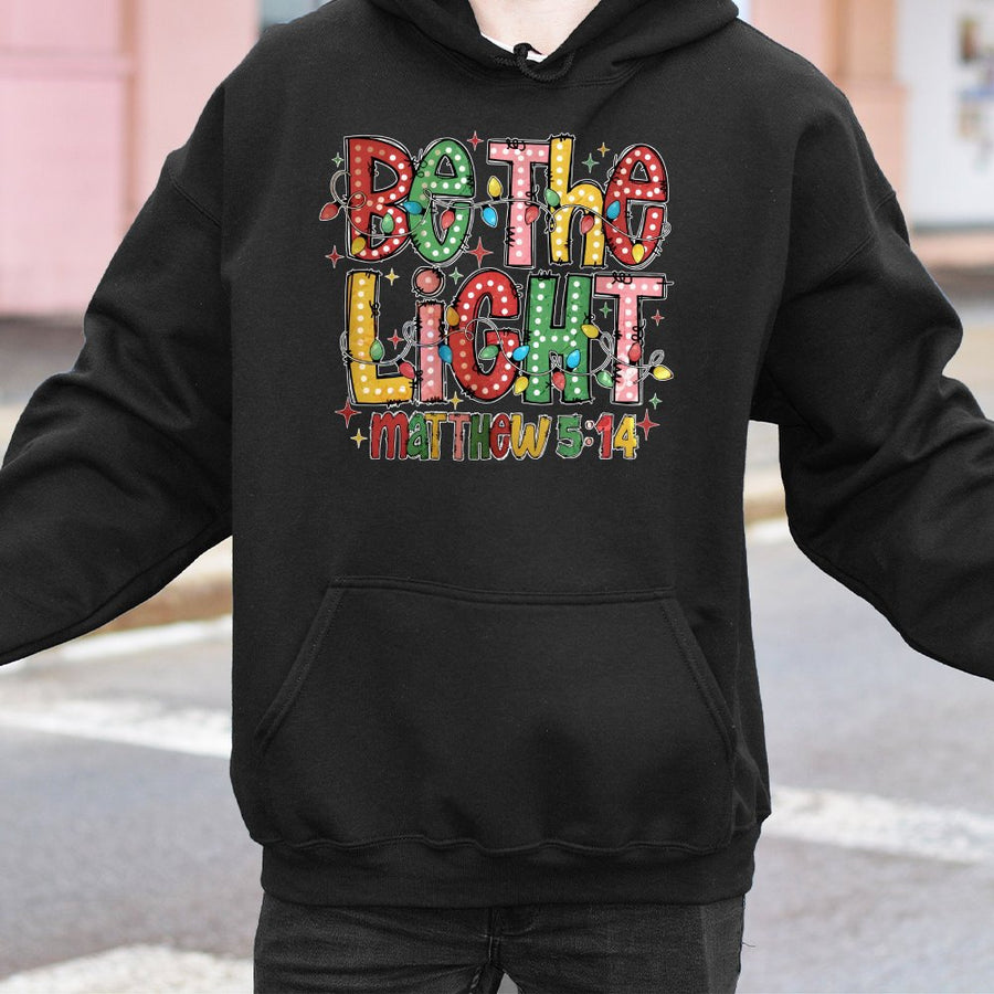Be The Light Matthew 5:14 Hoodie | Festive Christmas Lights Graphic | Cotton-Blend Comfort | Christian Gift for Faith-Inspired Holiday Apparel