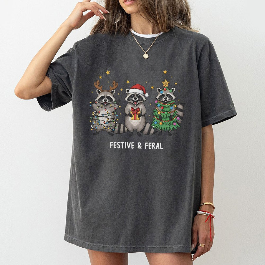 Festive and Feral Raccoon T-Shirt | Funny Christmas Animal Graphic | Soft 100% Cotton Premium Tee | Unique Holiday Gift for Men and Women
