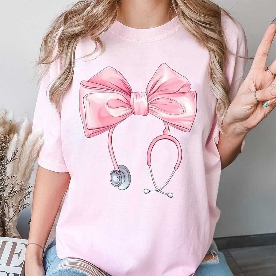 Coquette Nurse T-Shirt | Pink Bow Stethoscope Graphic Tee | 100% Cotton Premium Quality | Cute Nursing Student Gift & Appreciation Apparel
