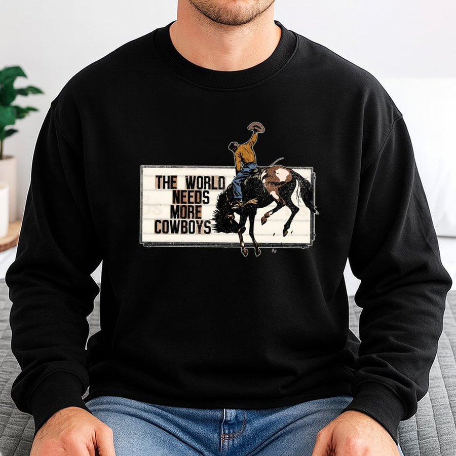The World Needs More Cowboys Sweatshirt | Vintage Rodeo Graphic Western Print | Cotton Blend Crewneck | Unisex Country Western Gift for Cowgirl