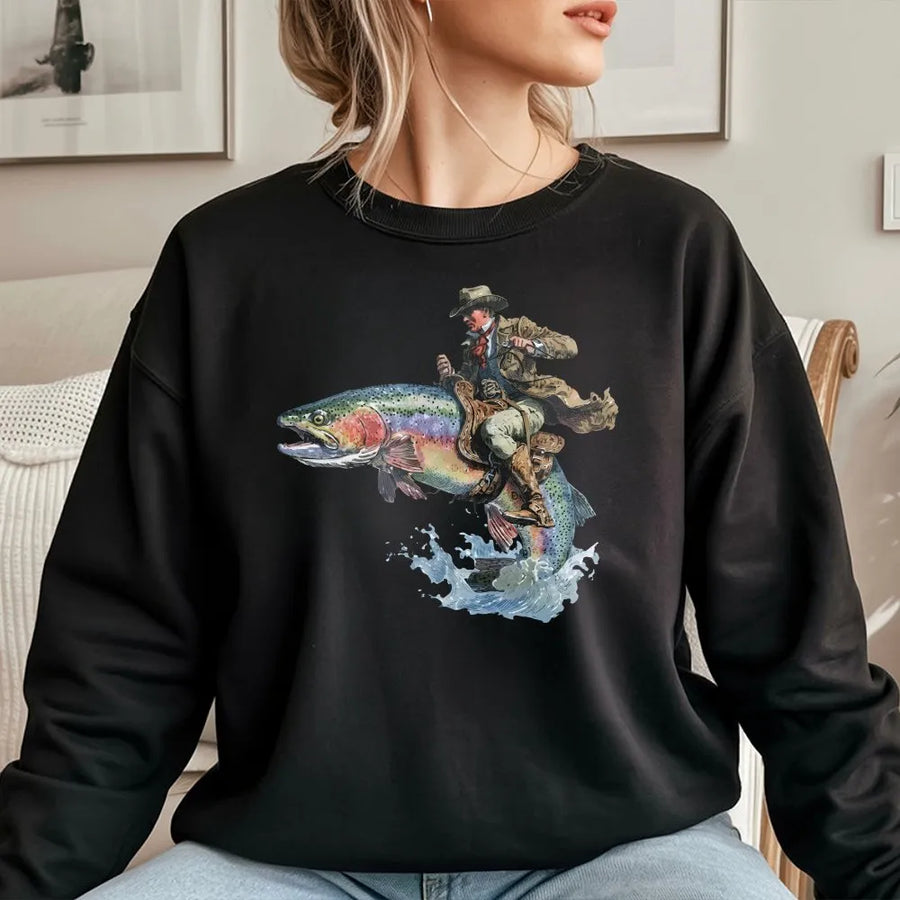 Cowboy Riding Fish Sweatshirt | Funny Western Trout Fishing Graphic Tee | Soft Cotton Unisex Top | Unique Gift for Angler