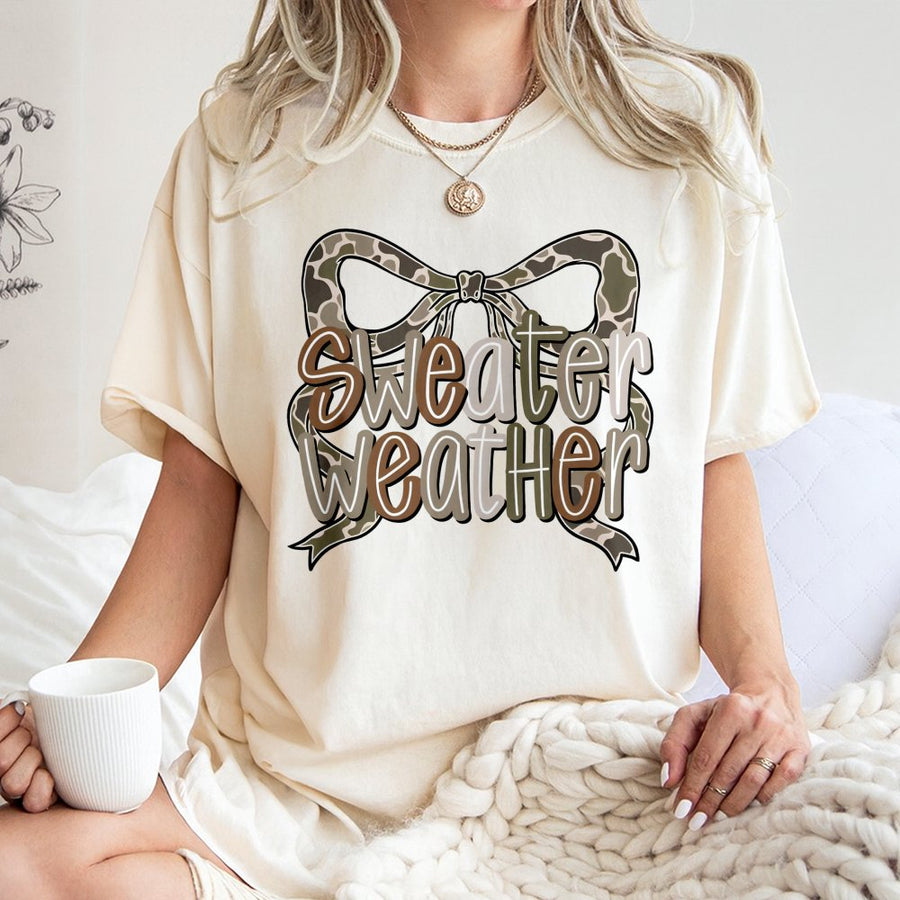 Sweater Weather T-Shirt | Camo Western Coquette Bow Graphic | Premium 100% Cotton Tee | Trendy Fall Gift for Women & Teens