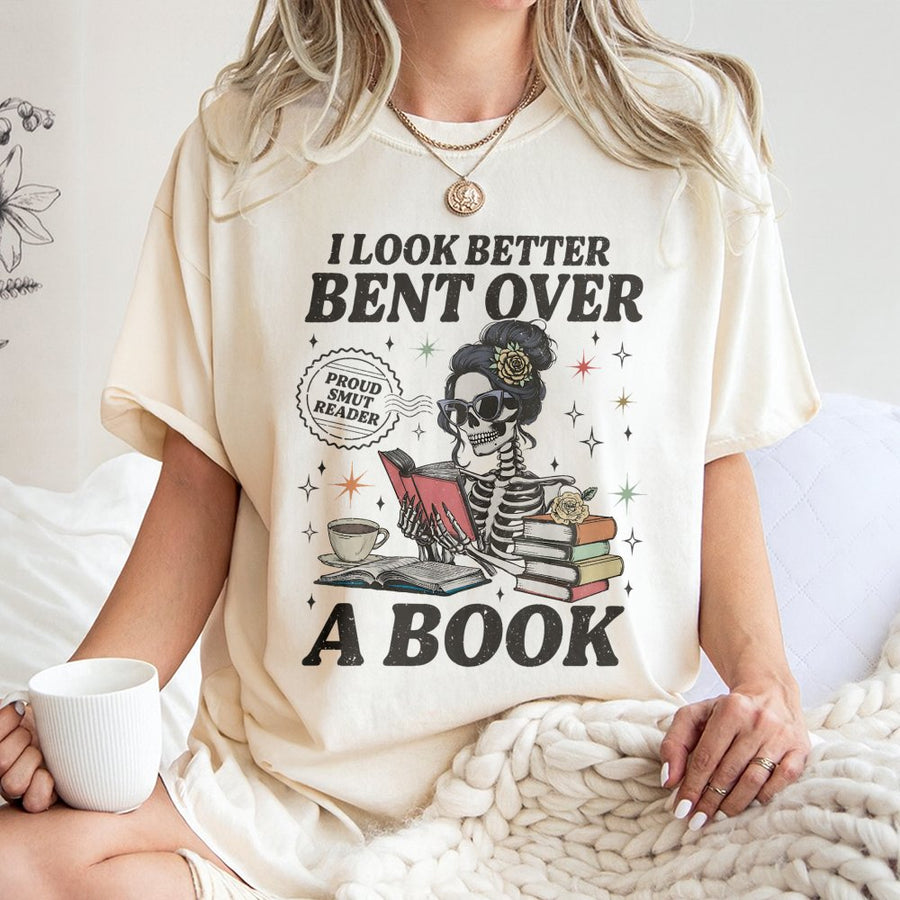 I Look Better Bent Over A Book T-Shirt | Skeleton Reading Graphic Design | Premium Cotton Apparel | Gift For Spicy Romance Readers & Book Lovers
