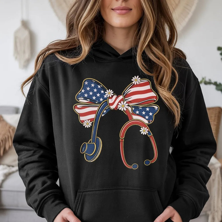 Patriotic Nurse Hoodie | Coquette USA Flag Stethoscope Bow Graphic | Soft Cotton Tee | 4th of July Gift for Medical Professional