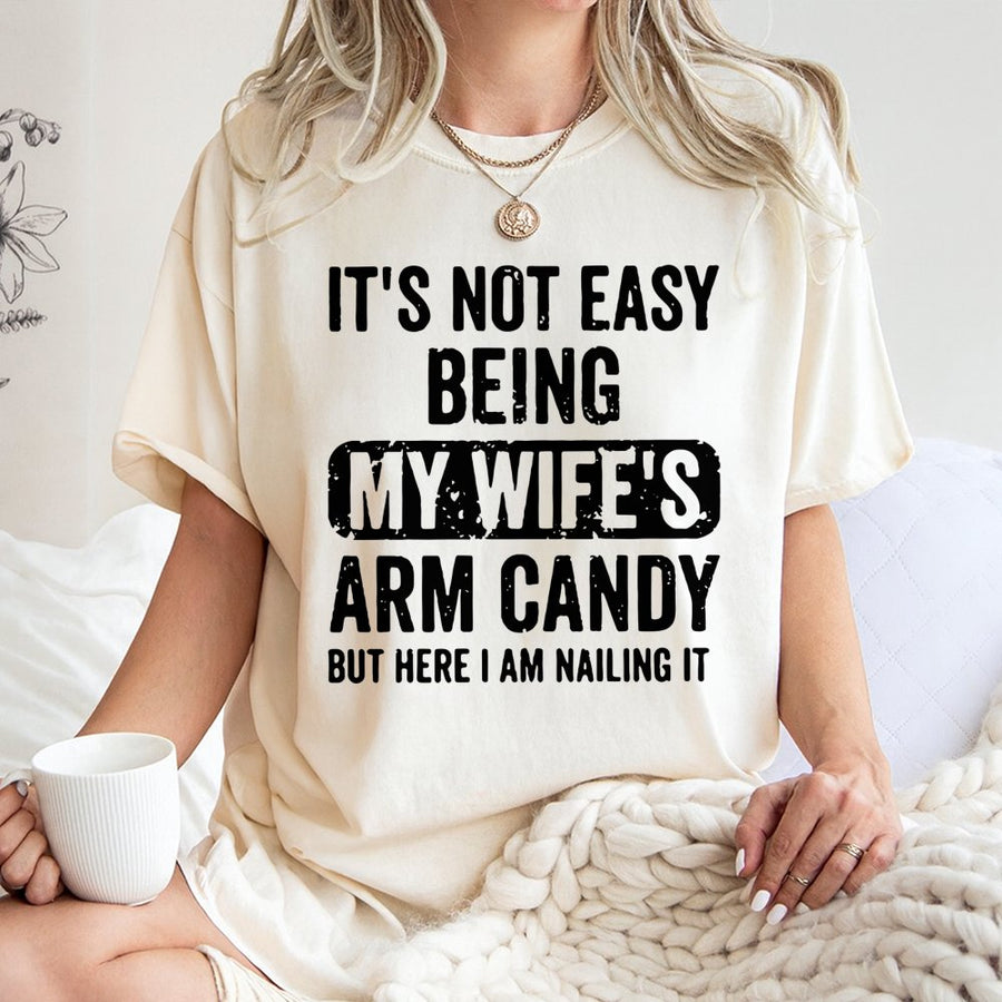 Funny Husband Graphic T-Shirt | Not Easy Being My Wife's Arm Candy Slogan | Premium Soft Cotton | Best Gift For Husband Birthday or Anniversary