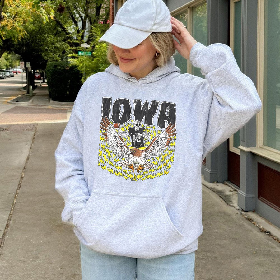 Iowa With A Skeleton Football Player Holding A Football And Riding A Hawk Surrounded By Flames Hoodie