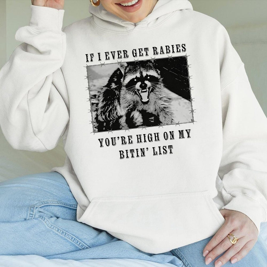 Raccoon Hoodie | Funny Rabies Bitin' List Graphic Print | Premium Cotton-Poly Blend | Unisex Gift for Wildlife Lovers