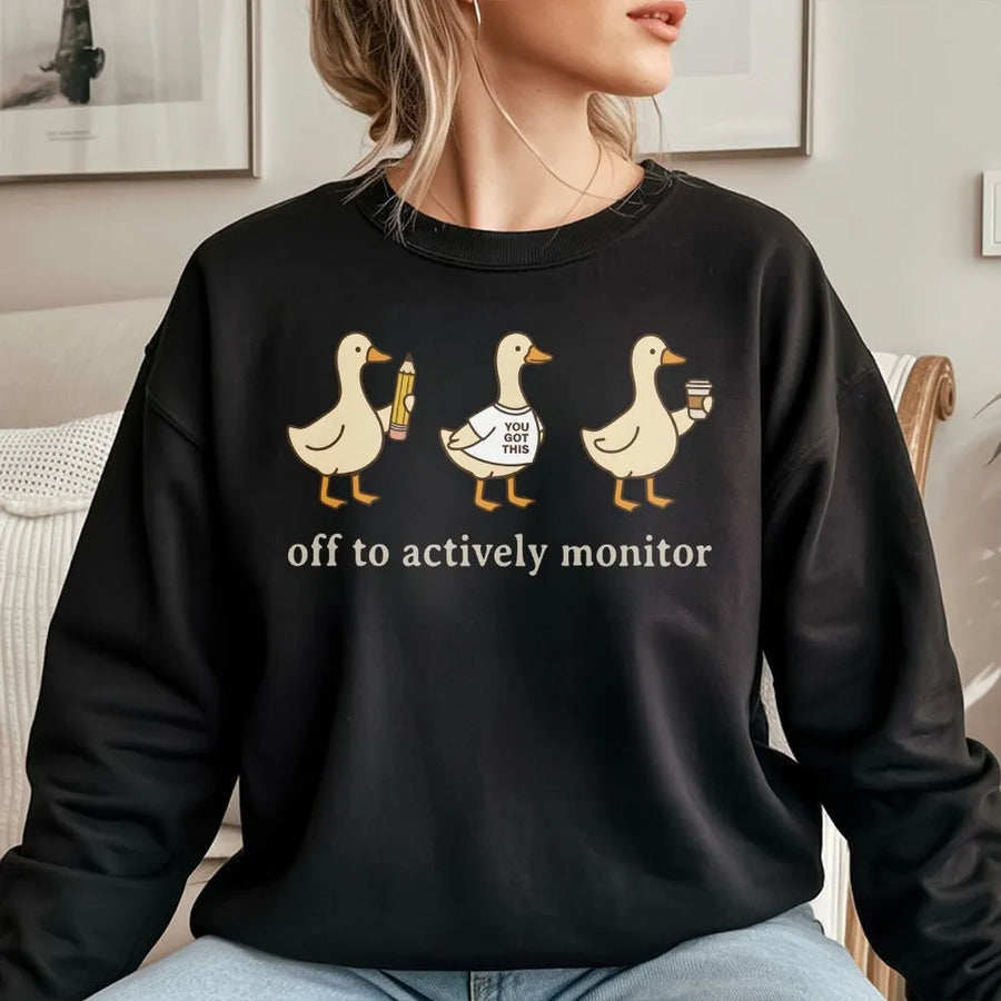 Actively Monitor Duck Sweatshirt | Funny Cartoon Ducks Slogan | Premium Cotton-Blend Sweatshirt | Sarcastic Office Humor Gift for Teacher or Nurse