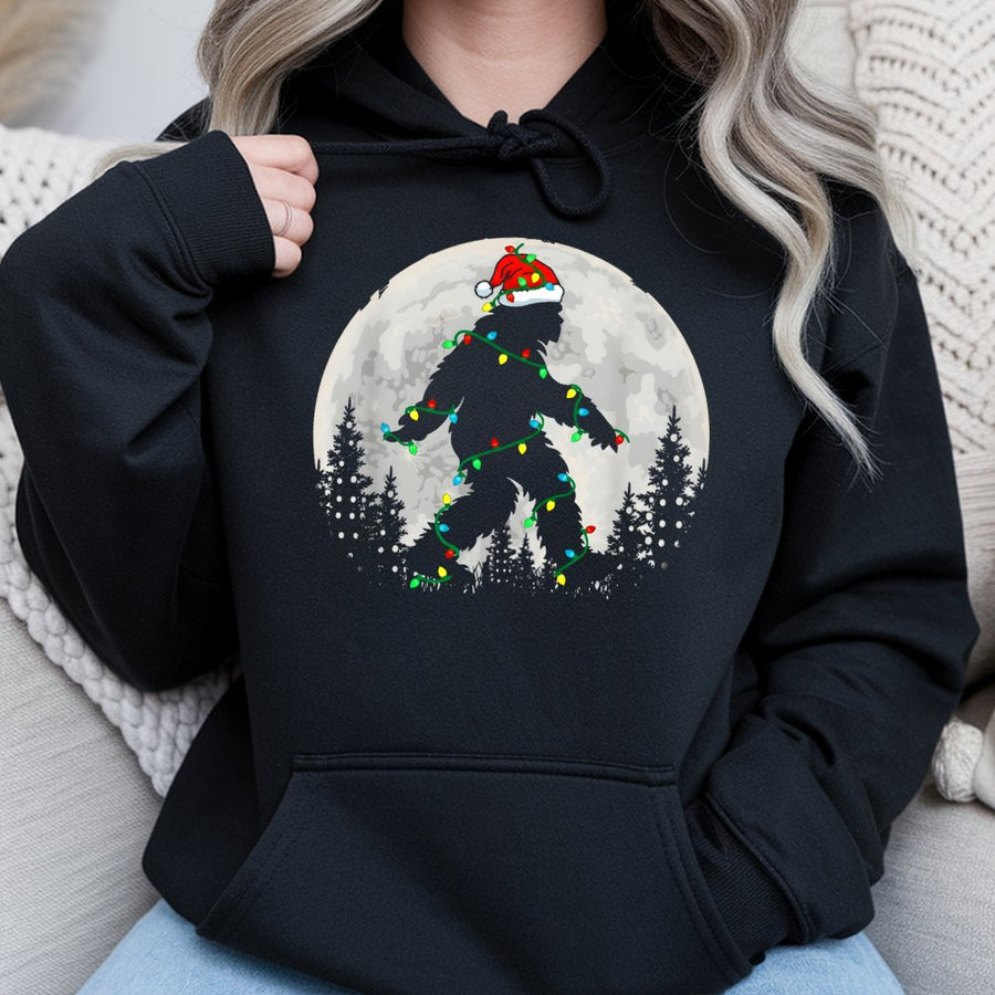 Bigfoot Christmas Hoodie | Sasquatch Wearing Santa Hat and Holiday Lights | Premium Cotton-Blend | Funny Winter Graphic Gift for Yeti Lovers