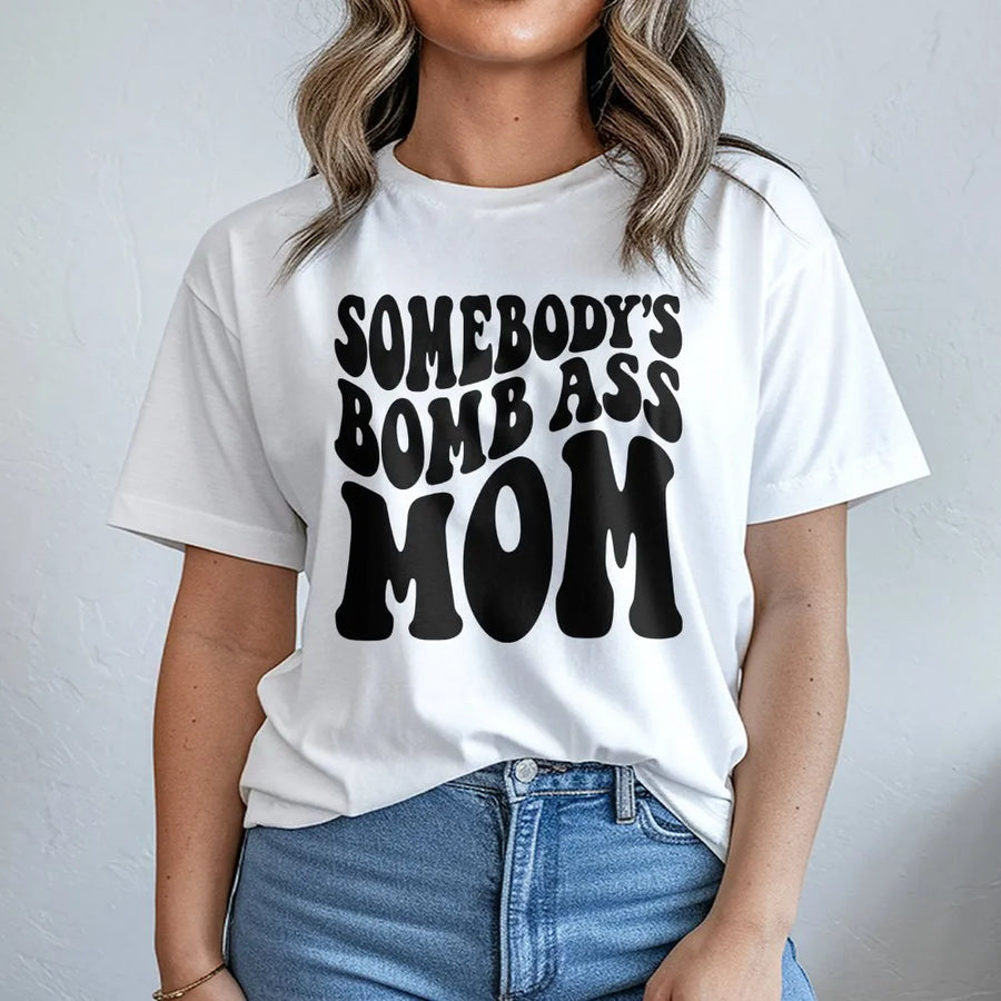 Somebody's Bomb Ass Mom T-Shirt | Retro Wavy Typography Graphic Tee | Premium 100% Cotton | Funny Mother's Day 2026 Gift for New Mom