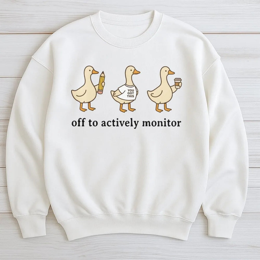 Actively Monitor Duck Sweatshirt | Funny Cartoon Ducks Slogan | Premium Cotton-Blend Sweatshirt | Sarcastic Office Humor Gift for Teacher or Nurse