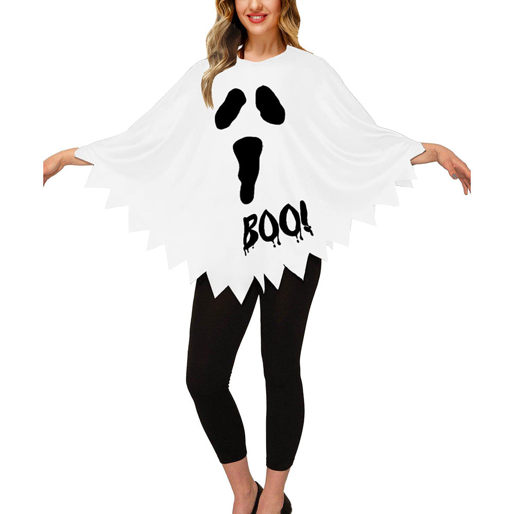White ghost poncho with a ghost face and the word BOO, worn over leggings