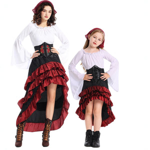 Mother and daughter in matching white pirate costumes