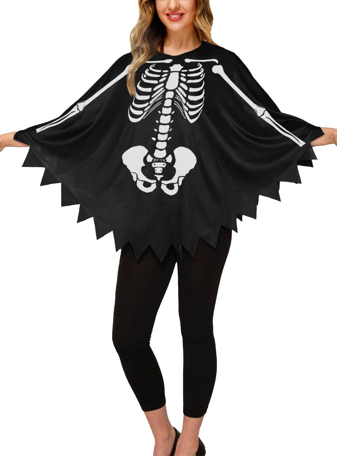 Skeleton poncho seen full length over black leggings