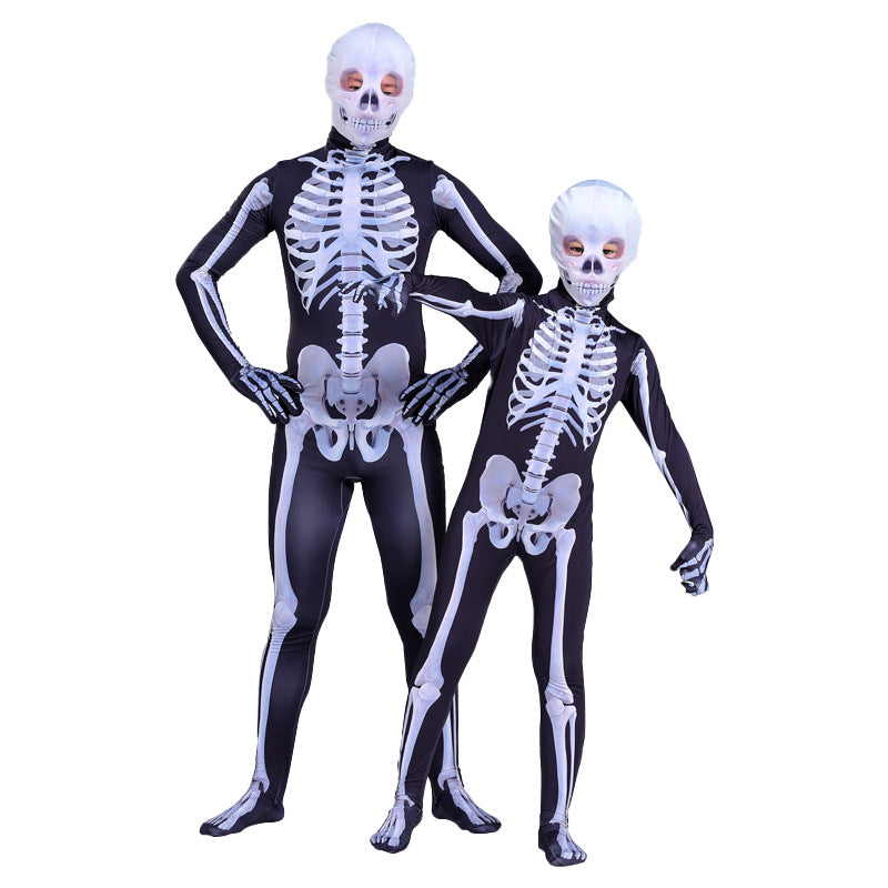 Adult and child in matching skeleton jumpsuits with skull headgear, side by side