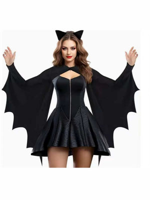 Black bat-wing dress with lace bat mask on a woman, arms out