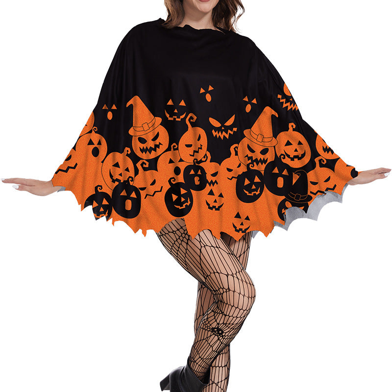 Black poncho with a crowd of orange pumpkins around the hem