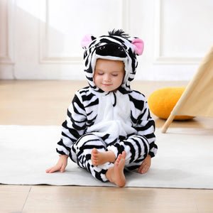 Baby sitting in the black and white zebra romper