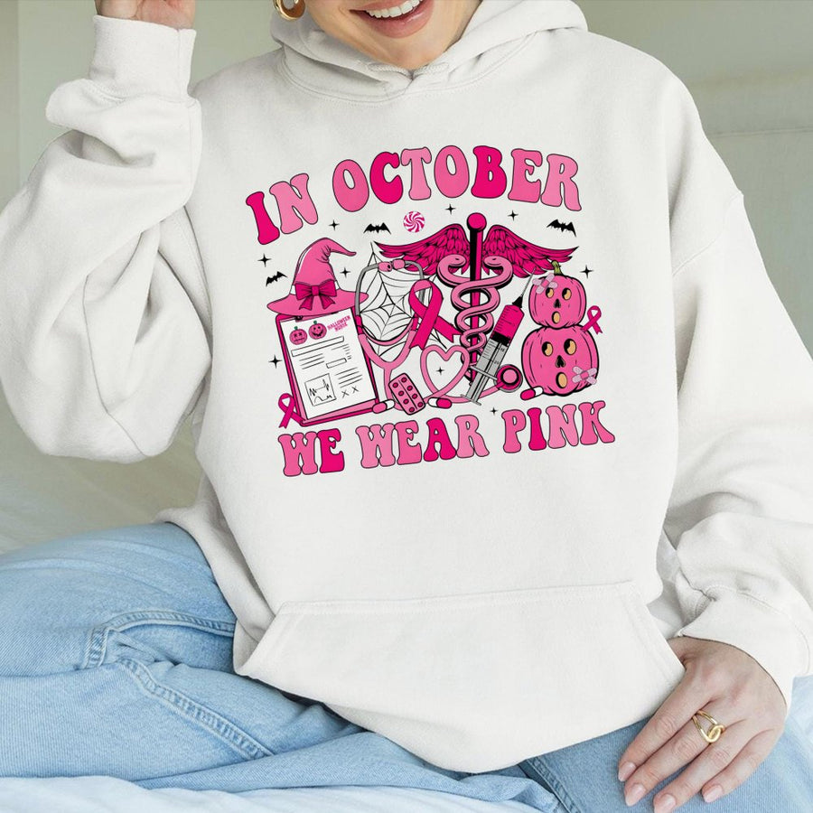 In October We Wear Pink Nurse Hoodie | Breast Cancer Awareness Halloween Graphic | Cotton-Blend Comfort | Gift for Nurses and Cancer Survivors