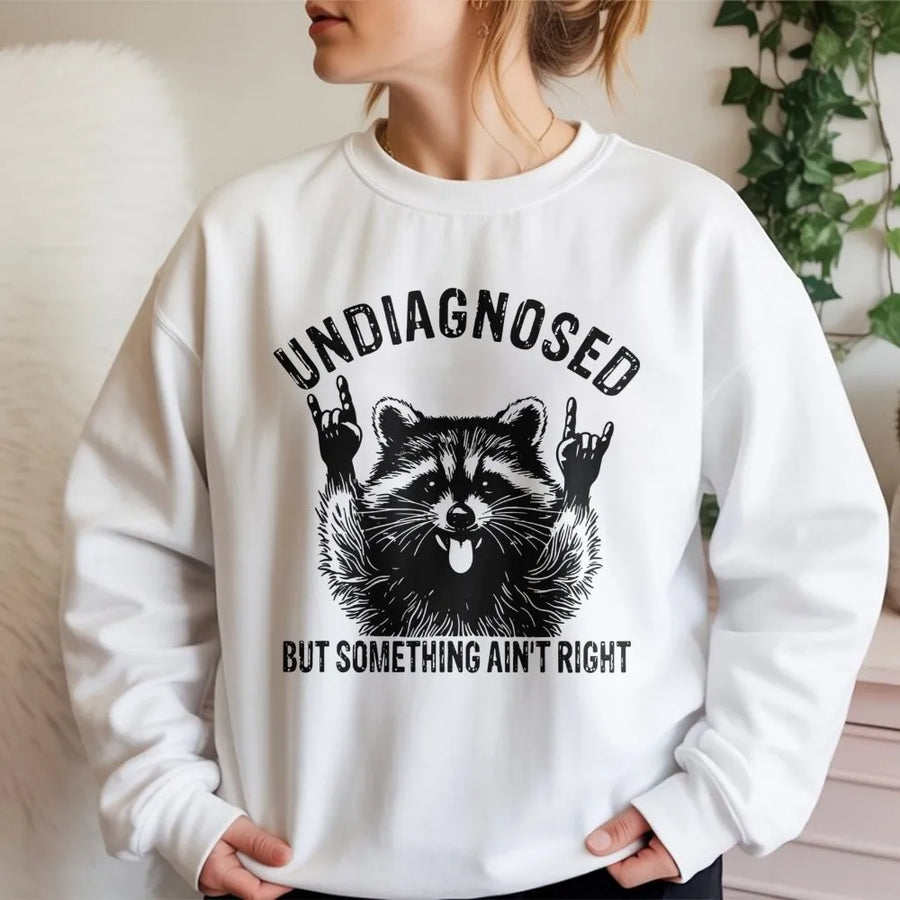 Undiagnosed But Something Ain't Right Sweatshirt | Funny Raccoon Graphic Tee | Premium Cotton Blend Crewneck | Sarcastic Neurodivergent Gift