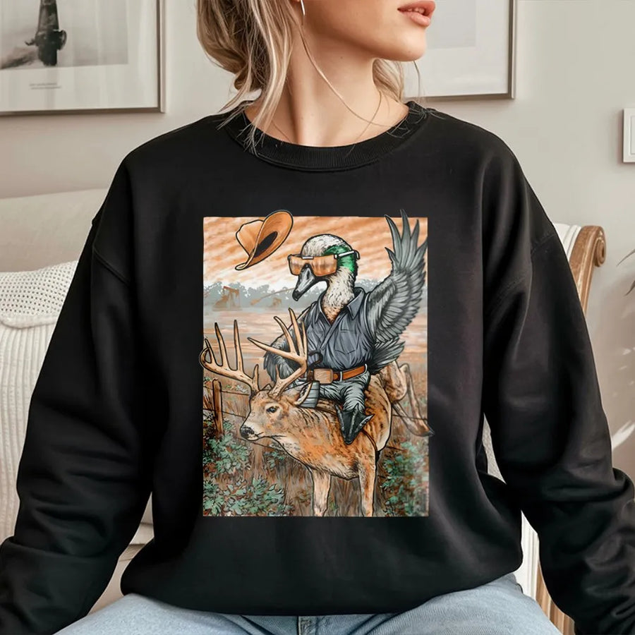 Duck Riding A Deer Sweatshirt | Funny Hunting Humor Graphic | Soft Cotton-Blend Premium Apparel | Unique Gift For Hunters And Outdoor Enthusiasts