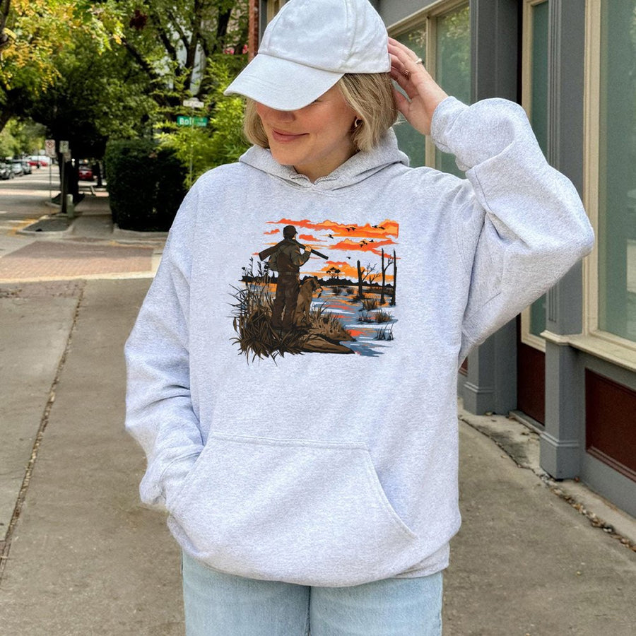 Duck Hunting Hoodie | Hunter and Retriever Sunset Graphic | Premium Cotton Blend | Gift for Outdoorsmen and Waterfowl Hunters