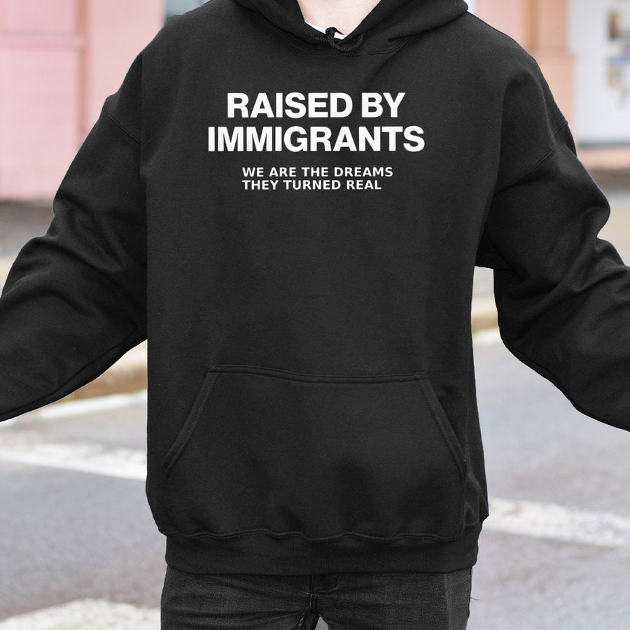 Raised By Immigrants Hoodie | Inspirational Quote Graphic Sweatshirt | Premium Cotton-Blend Streetwear | Gift For Proud First Generation Americans
