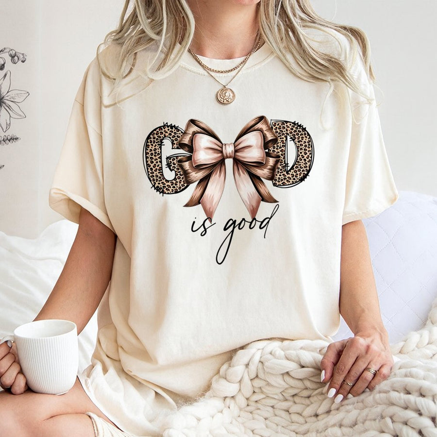 God Is Good T-Shirt | Leopard Print Bow Christian Graphic Tee | Premium 100% Cotton Apparel | Inspirational Faith Gift for Women
