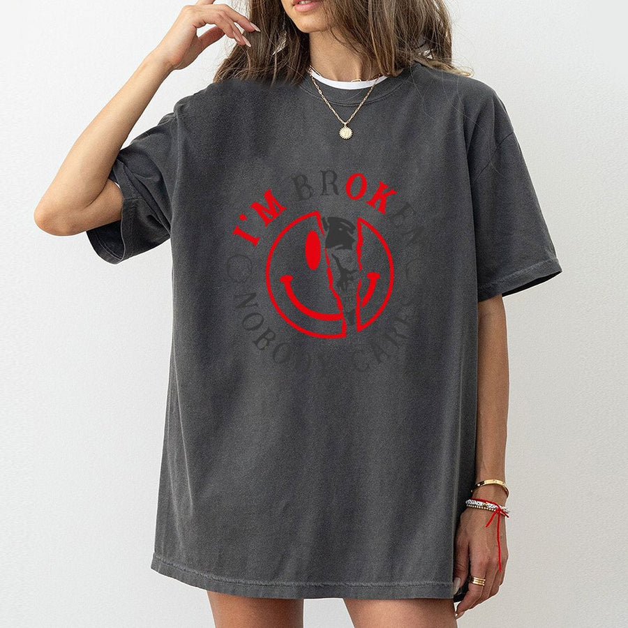 Broken Smiley Face Graphic T-Shirt | Edgy Skull Emoji Streetwear Design | Premium Soft Cotton Unisex Tee | Gift for Grunge Alternative Fans