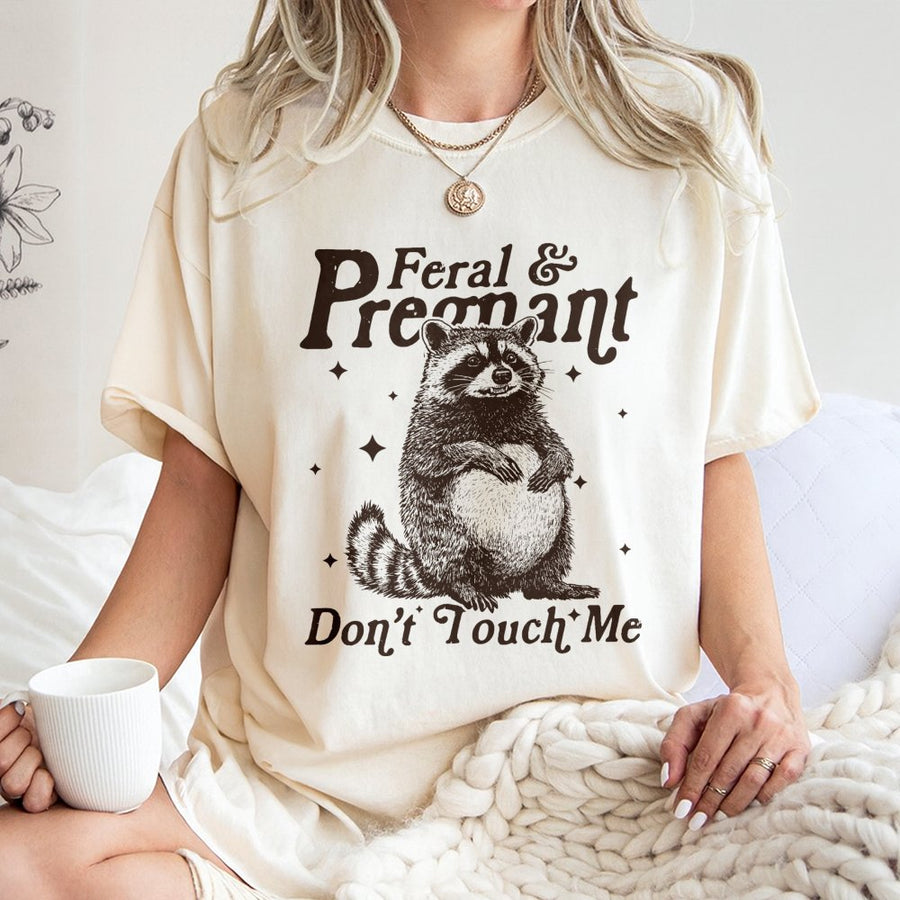 Feral and Pregnant Raccoon T-Shirt | Funny Maternity Graphic Tee | Premium 100% Cotton | Humorous Gift for First Time Moms and Expecting Women