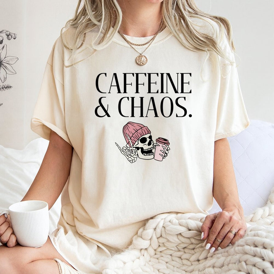 Caffeine & Chaos Graphic T-Shirt | Skeleton In Pink Beanie Drinking Coffee | 100% Cotton Premium Tee | Fun Aesthetic Gift For Coffee Lovers