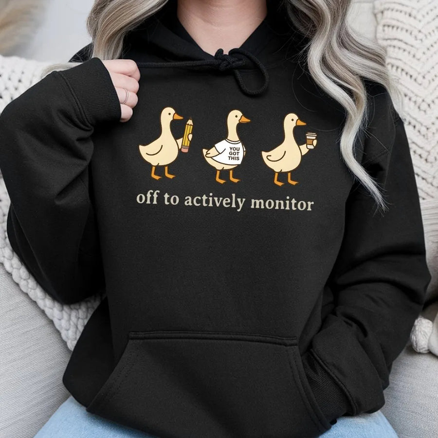 Actively Monitor Duck Hoodie | Funny Cartoon Ducks Slogan | Premium Cotton-Blend Sweatshirt | Sarcastic Office Humor Gift for Teacher or Nurse