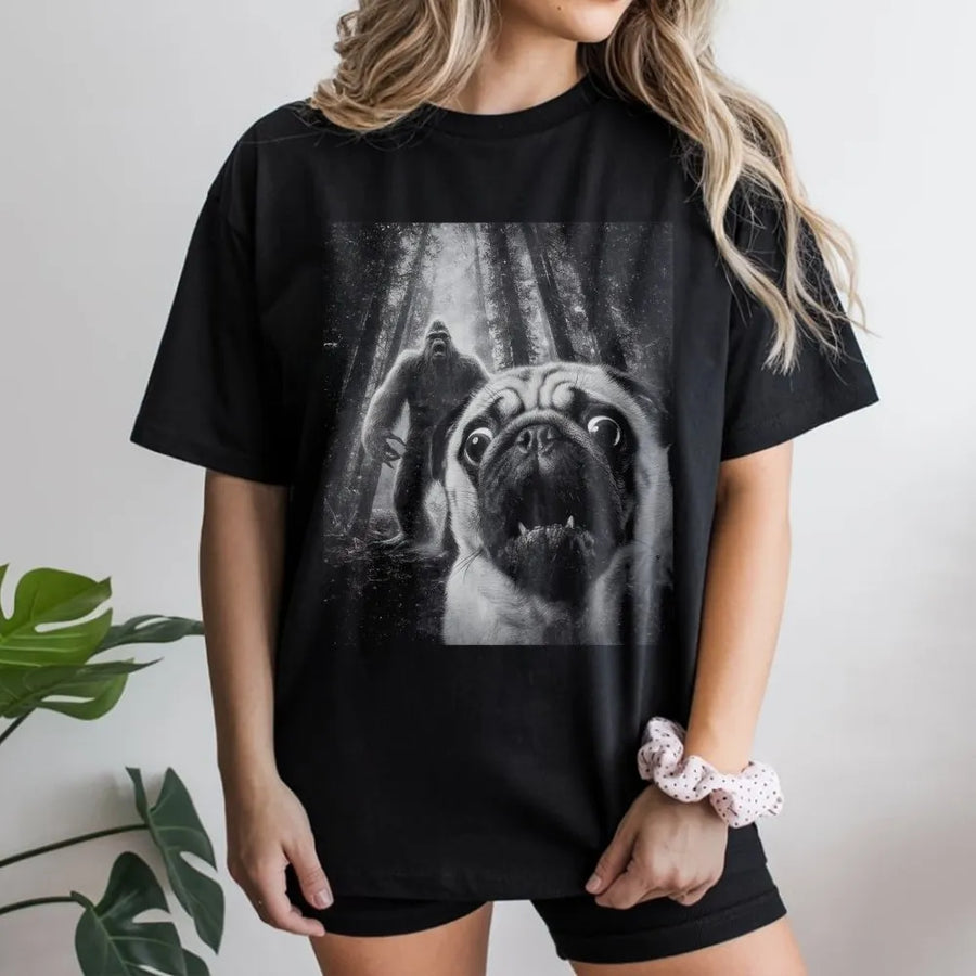 Funny Pug Bigfoot T-Shirt | Scared Dog Sasquatch Graphic Tee | Premium Cotton Casual Wear | Unique Gift for Pug Lovers and Cryptid Fans